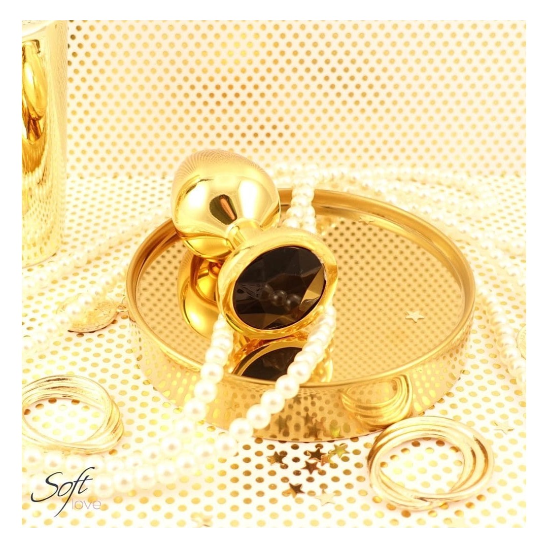 Plug bijou doré avec un bijou en cristal noir