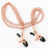 Pinces à seins or rose avec chaines